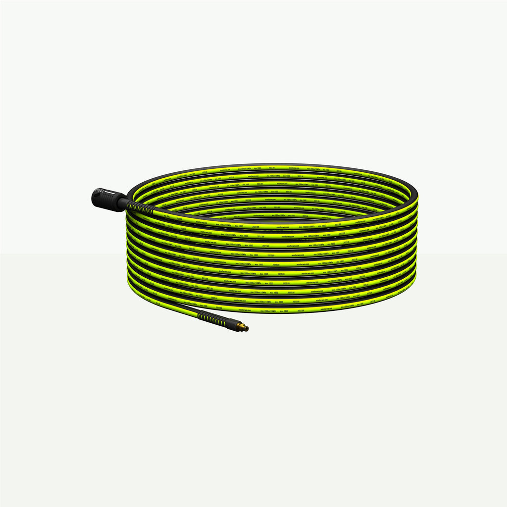 Coiled green and black hose with  black connectors